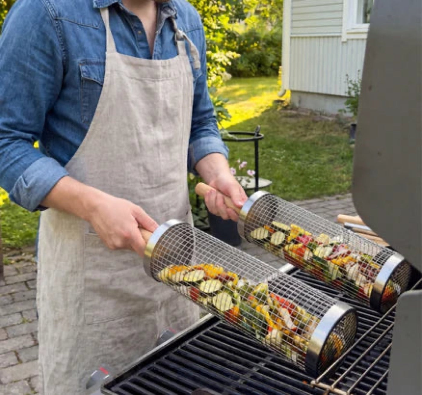 Removable cool-touch handle on the Rolling Grill Basket